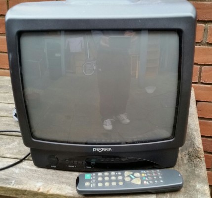 14 inch TV (old CRT box type). with original remote. In good clean working condition.